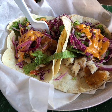 Cali N Tito's signature dishes Fish Tacos, Cuban Sandwich, Lomo Saltado, Spicy Chicken Burrito